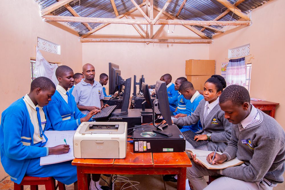 Students and a teacher in the computer lab